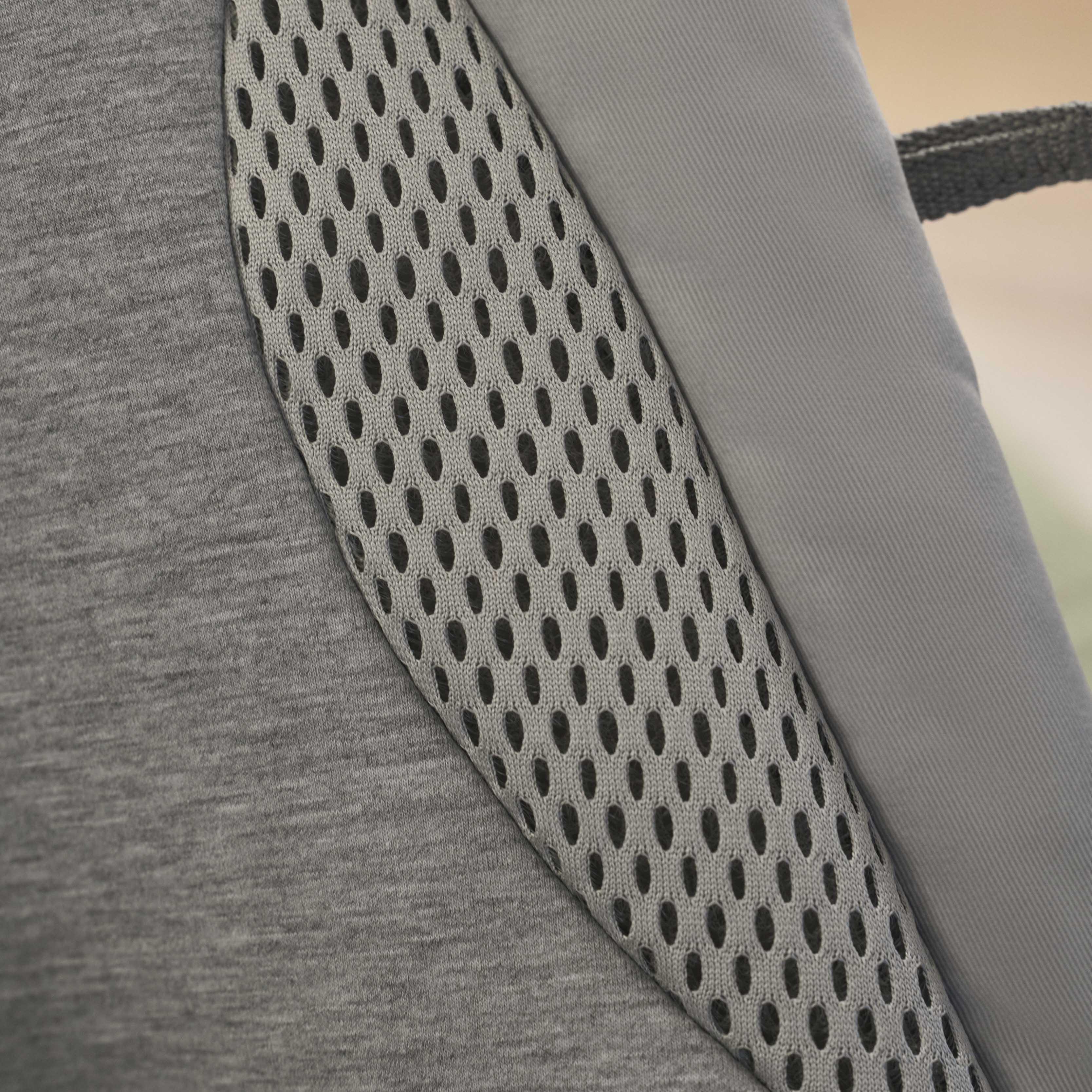 Close-up of a fabric with gray mesh and smooth material, showing texture and contrast in design.